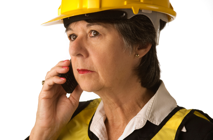 Image of a lady who is a fire warden on the phone