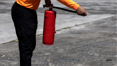 Somebody testing a fire extinguisher